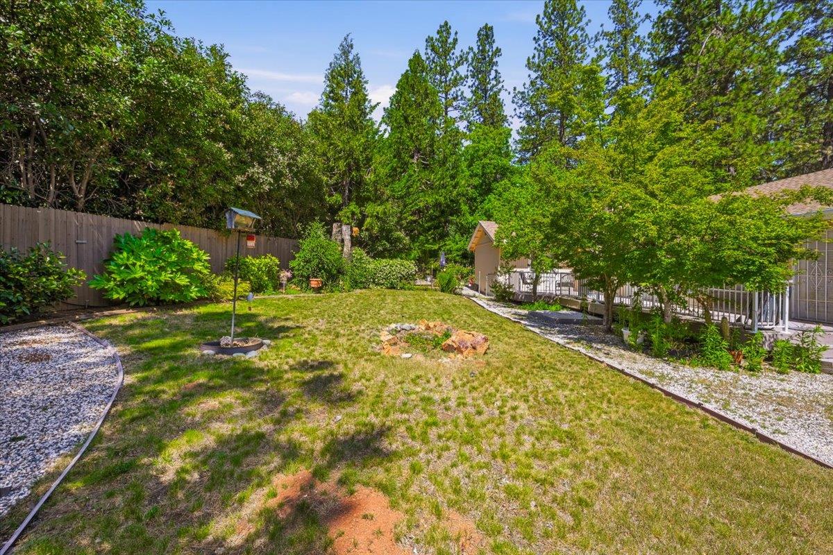 12600 Friar Tuck Road Grass Valley, CA 95949 - Photo 38 of 56 a view of yard with swimming pool and green space