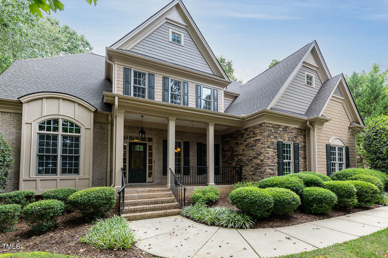 front view of a house with a garden