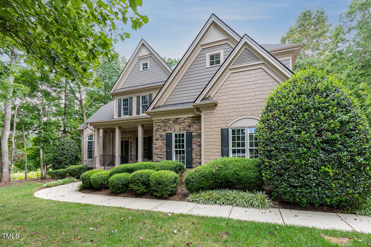 1097 Tacketts Pond Drive Raleigh, NC 27614 - Photo 2 of 38 a front view of a house with a yard