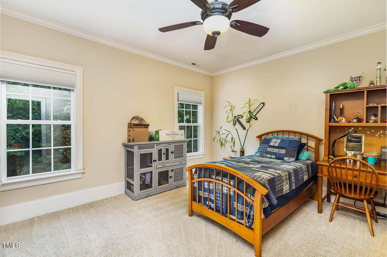 1097 Tacketts Pond Drive Raleigh, NC 27614 - Photo 23 of 38 a bedroom with a bed and a window