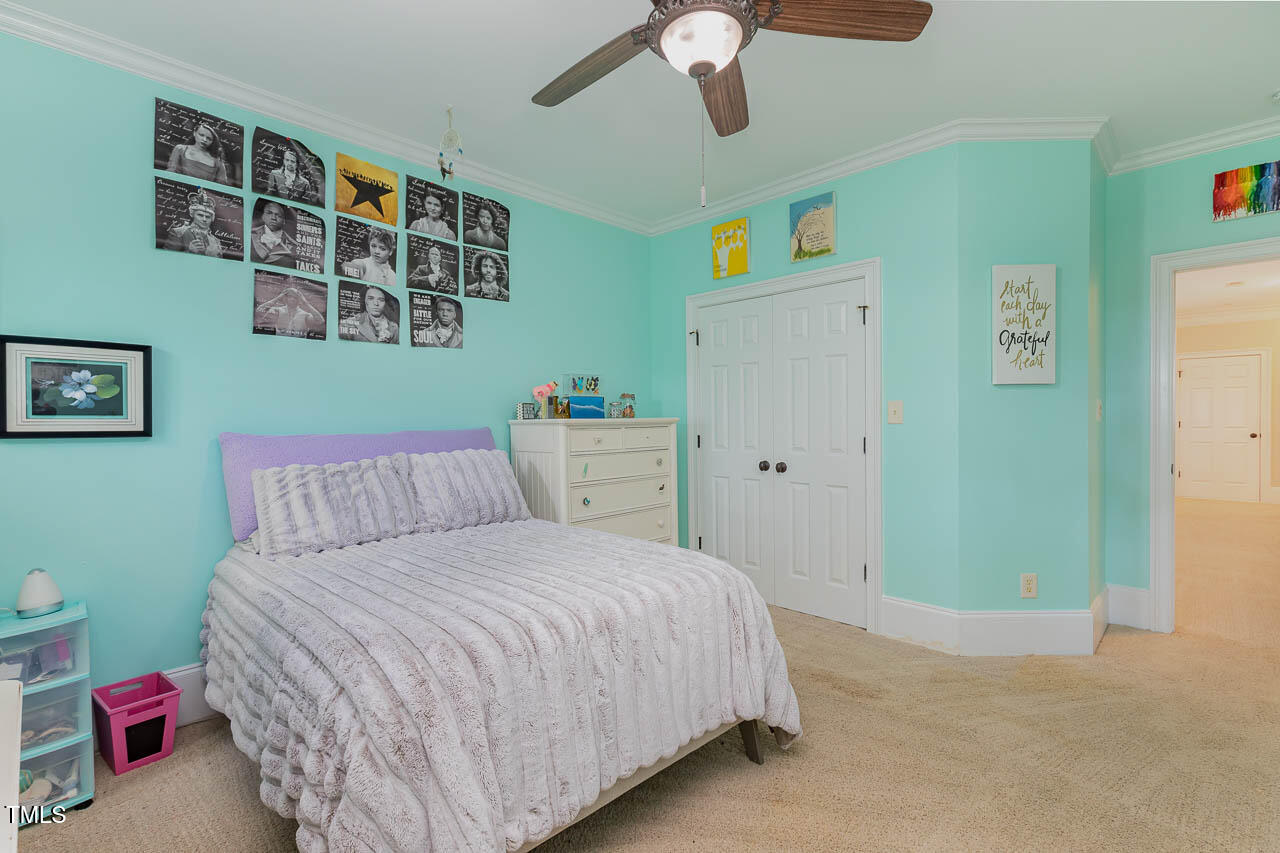 1097 Tacketts Pond Drive Raleigh, NC 27614 - Photo 32 of 38 a bedroom with a bed and a window