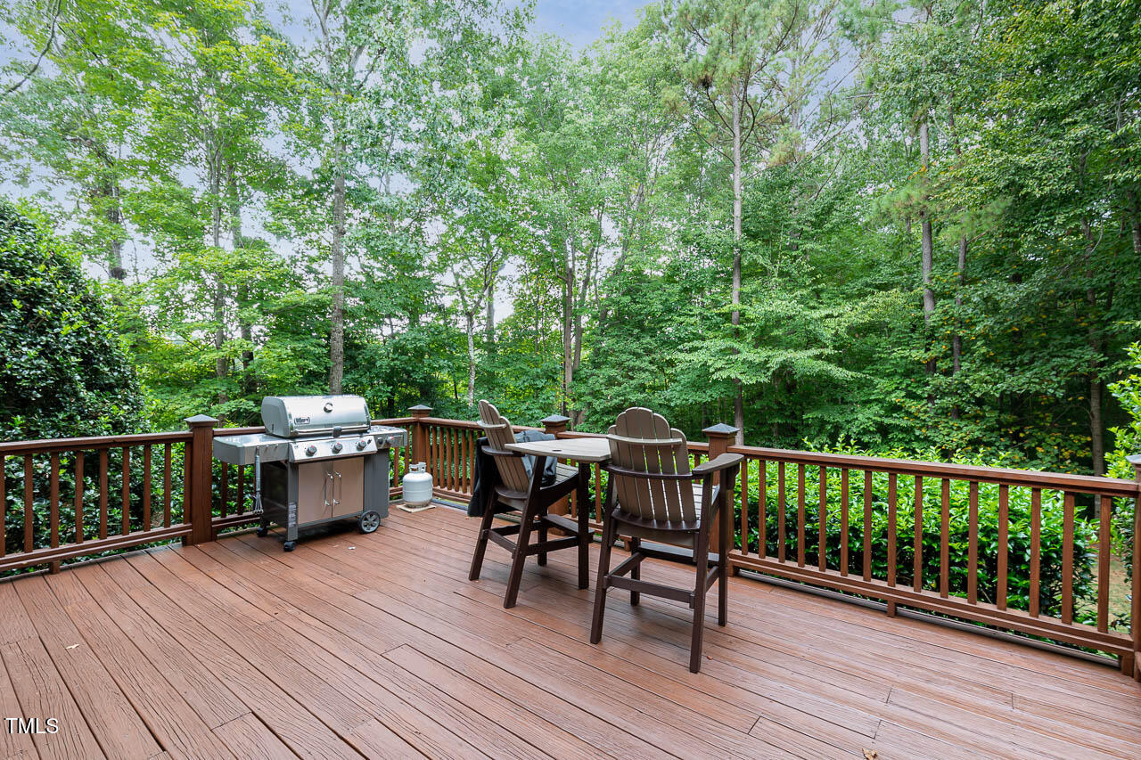1097 Tacketts Pond Drive Raleigh, NC 27614 - Photo 34 of 38 a view of a deck with furniture and trees around