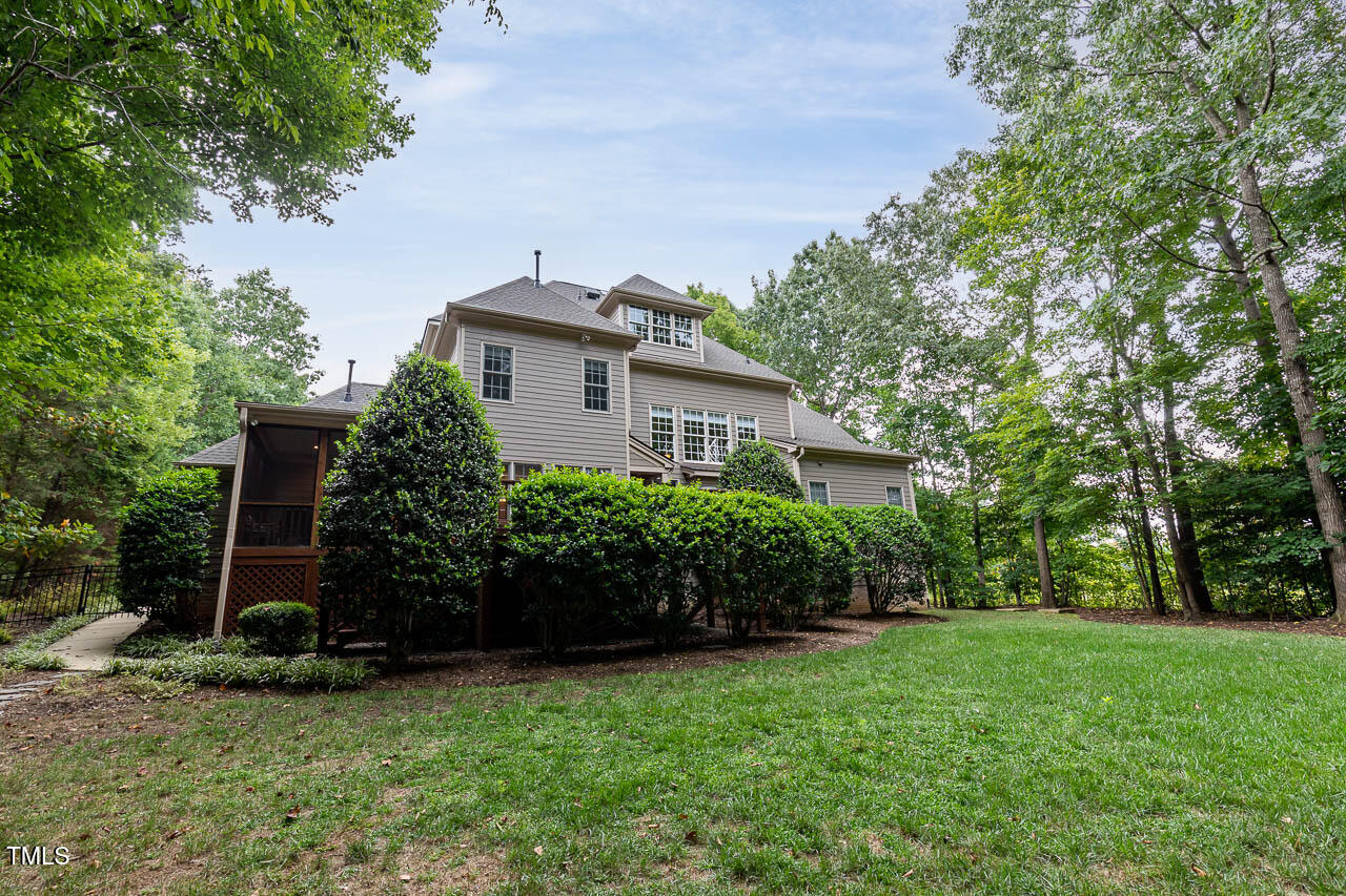 1097 Tacketts Pond Drive Raleigh, NC 27614 - Photo 37 of 38 a front view of a house with a garden