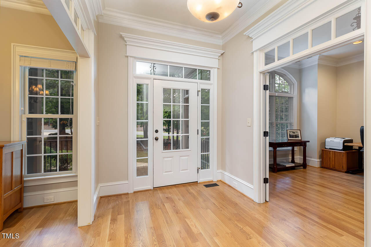 1097 Tacketts Pond Drive Raleigh, NC 27614 - Photo 5 of 38 a view of empty room with wooden floor and fan