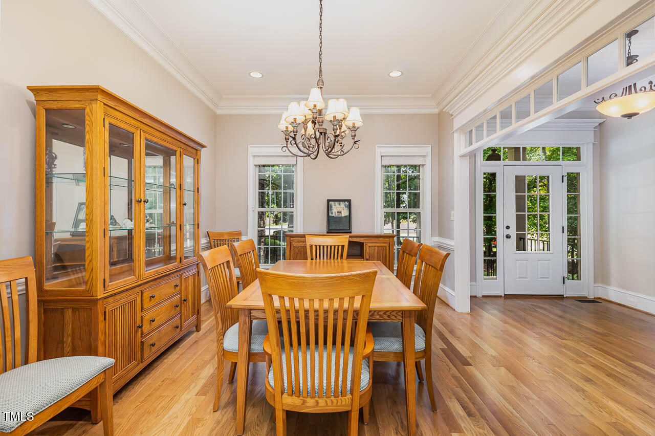 1097 Tacketts Pond Drive Raleigh, NC 27614 - Photo 7 of 38 a view of a dining room with furniture window and wooden floor