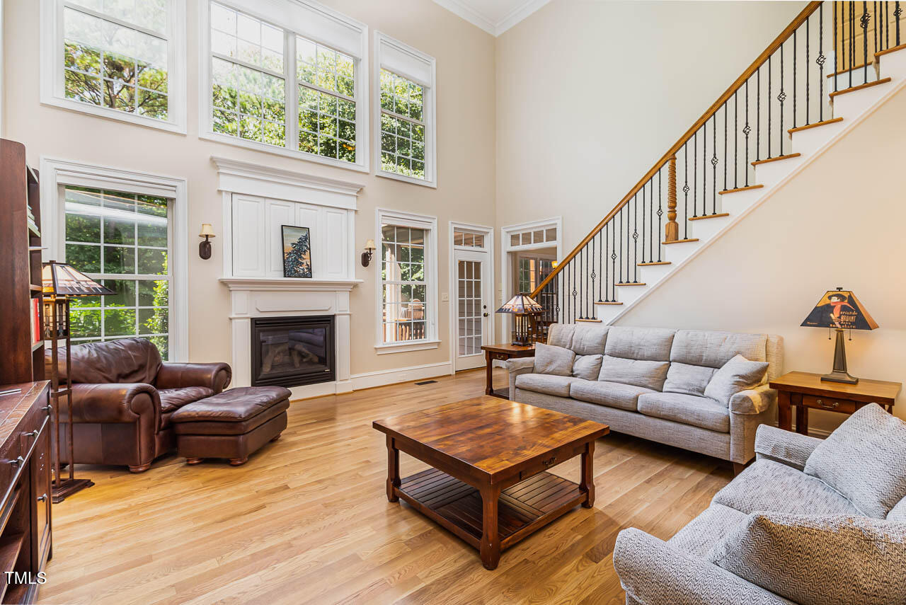 1097 Tacketts Pond Drive Raleigh, NC 27614 - Photo 9 of 38 a living room with furniture fireplace and a large window