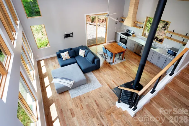 a kitchen with a table chairs a sink dishwasher stove and refrigerator