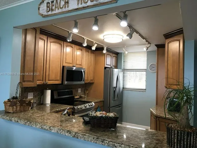 a bedroom with two beds and a window