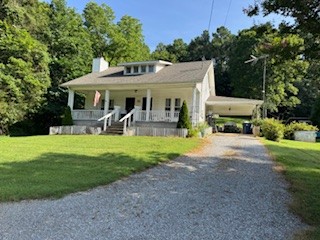 301 Red Tuttle Road Bethpage, TN 37022 - Photo 6 of 9 a view of a house with backyard sitting area and garden