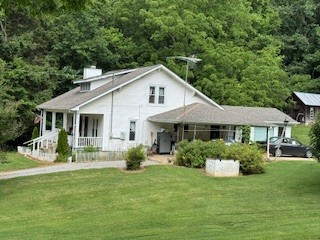 301 Red Tuttle Road Bethpage, TN 37022 - Photo 8 of 9 a front view of house with a garden and porch