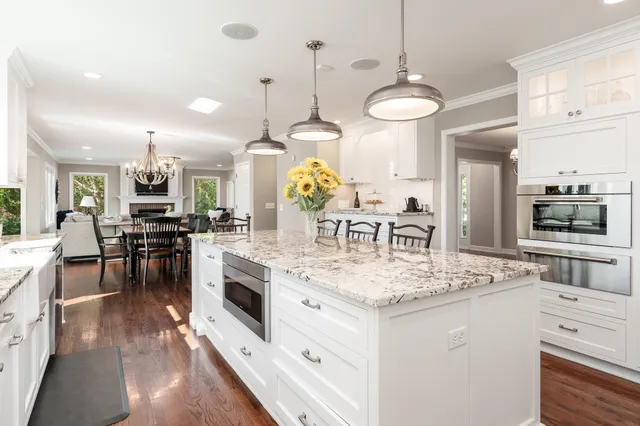 a kitchen with a stove top oven sink and cabinets