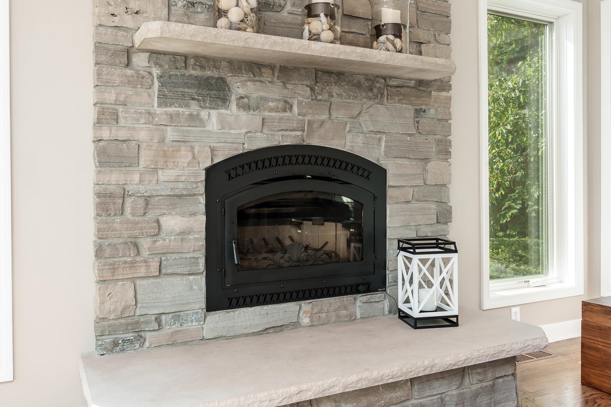 8551 Rote Road Rockford, IL 61107 - Photo 21 of 92 a fireplace with a wooden floor