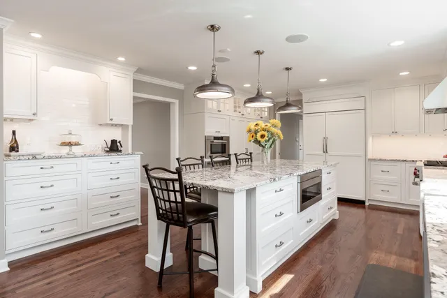 a bedroom with two beds and a flat screen tv