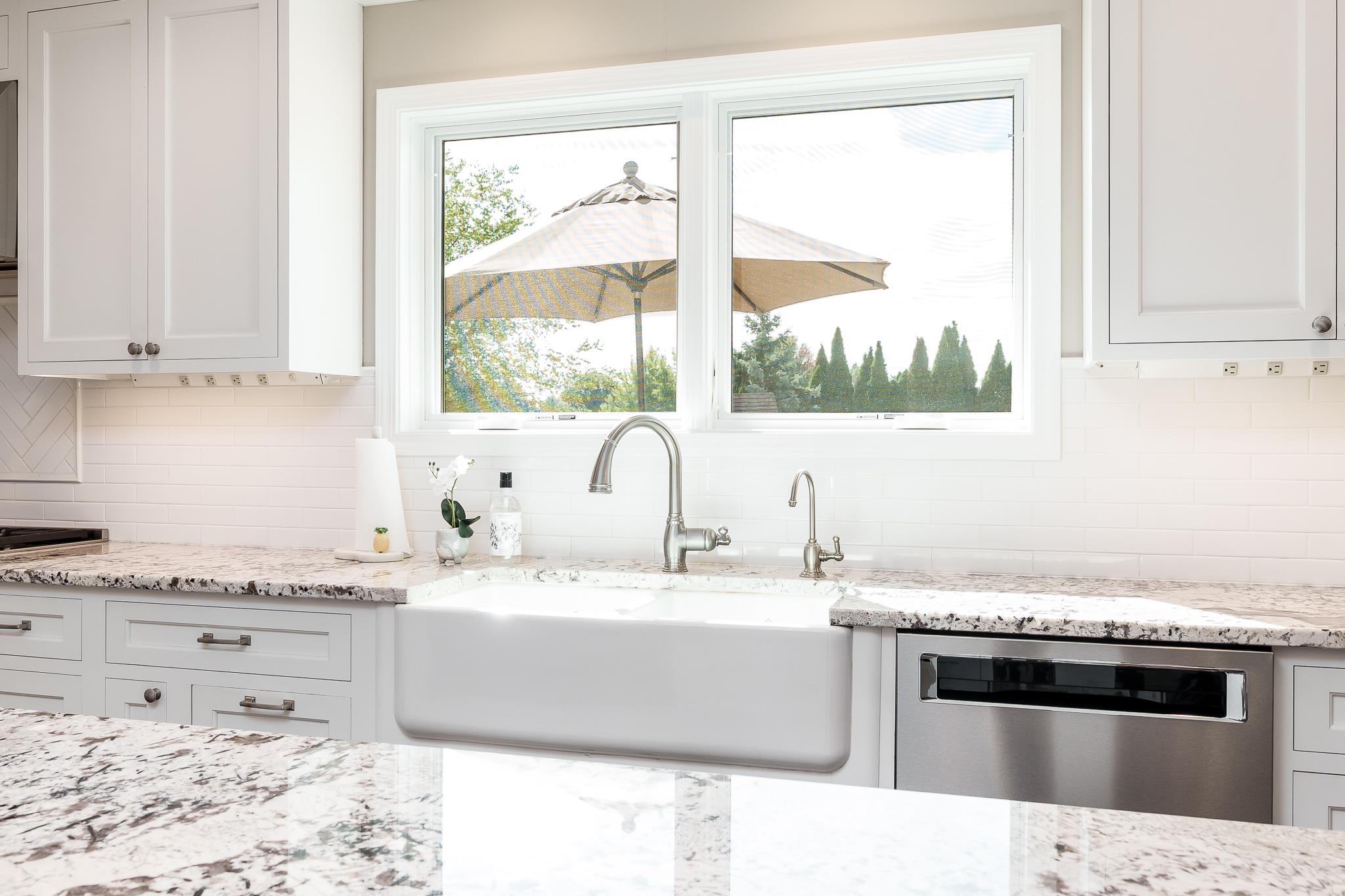 8551 Rote Road Rockford, IL 61107 - Photo 27 of 92 a kitchen with granite countertop a sink a counter top space and cabinets