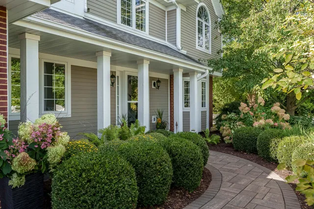 a front view of a house with a garage