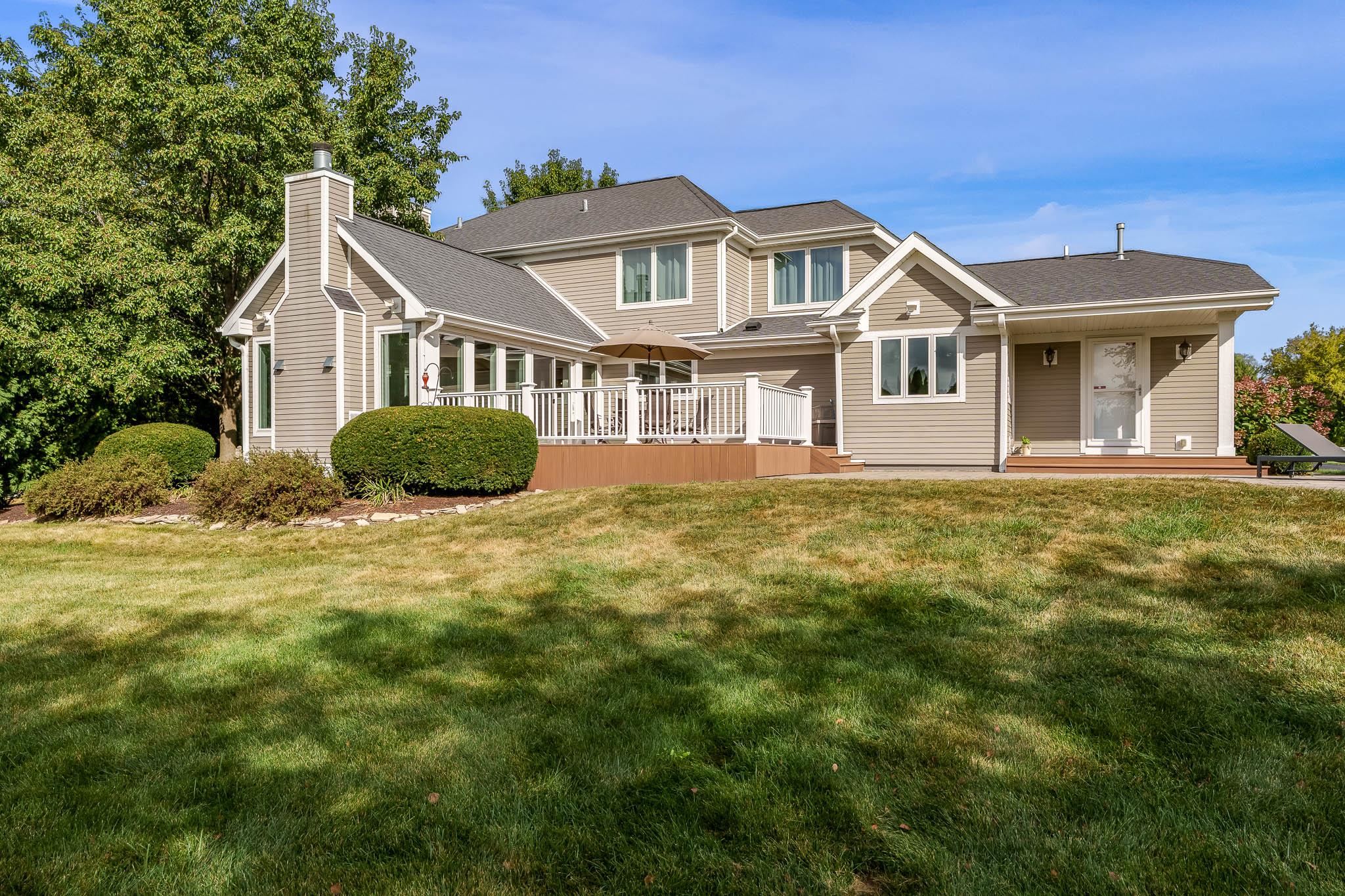 8551 Rote Road Rockford, IL 61107 - Photo 6 of 92 a front view of a house with a garden