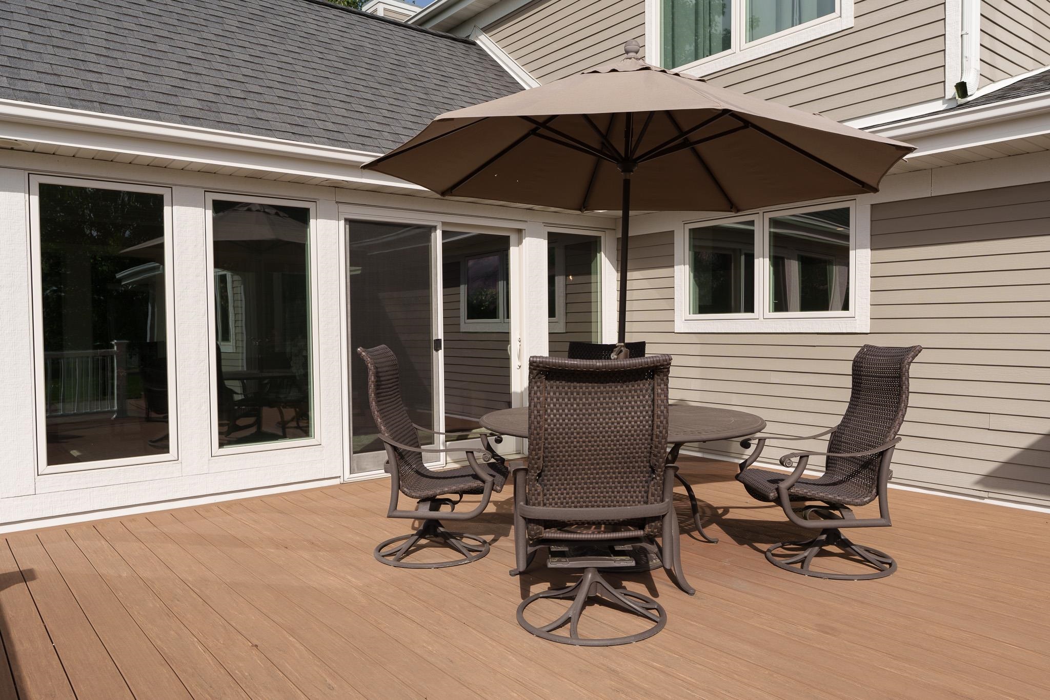 8551 Rote Road Rockford, IL 61107 - Photo 70 of 92 a view of a patio with table and chairs under an umbrella