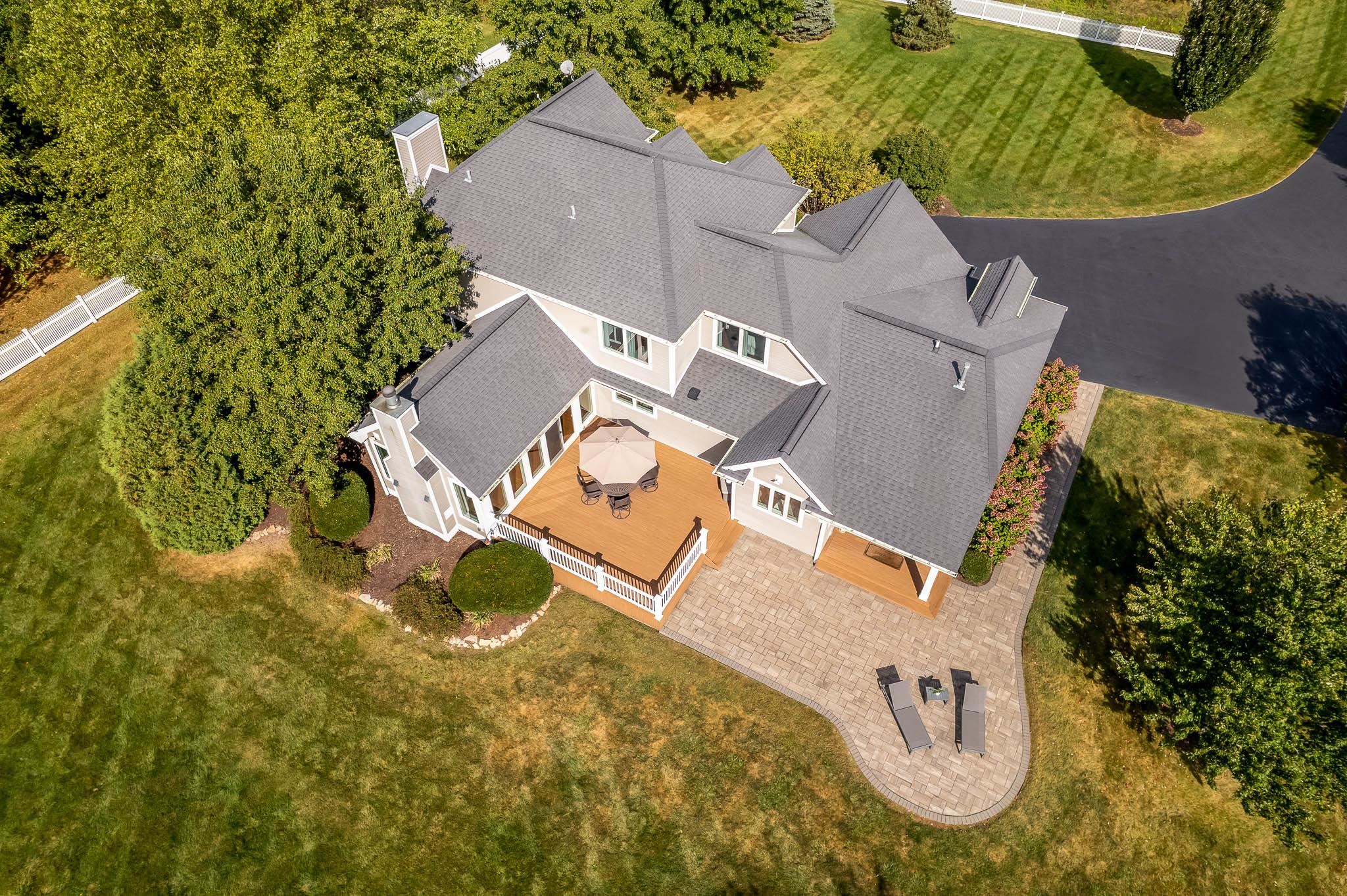 8551 Rote Road Rockford, IL 61107 - Photo 86 of 92 an aerial view of a house with swimming pool and large trees