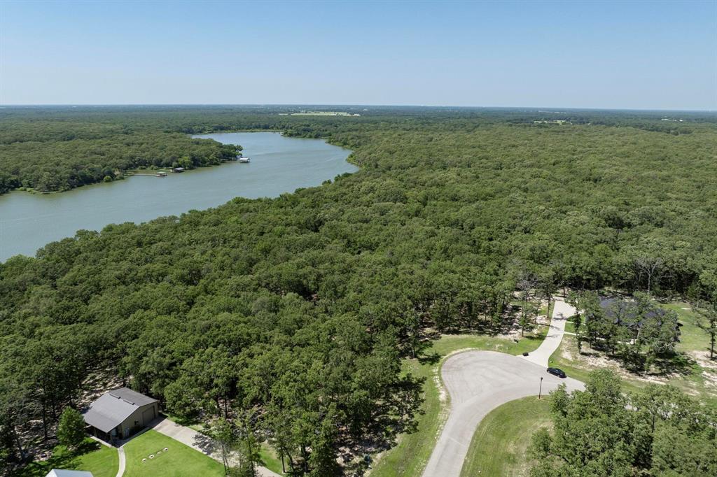 Lot 71 Anchor Quinlan, TX 75474 - Photo 13 of 18 a view of a lake with a yard