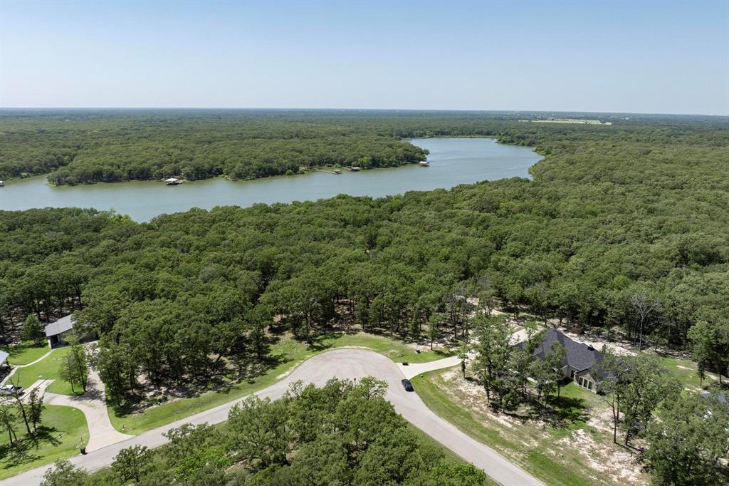 Lot 71 Anchor Quinlan, TX 75474 - Photo 14 of 18 a view of a lake with houses in the back