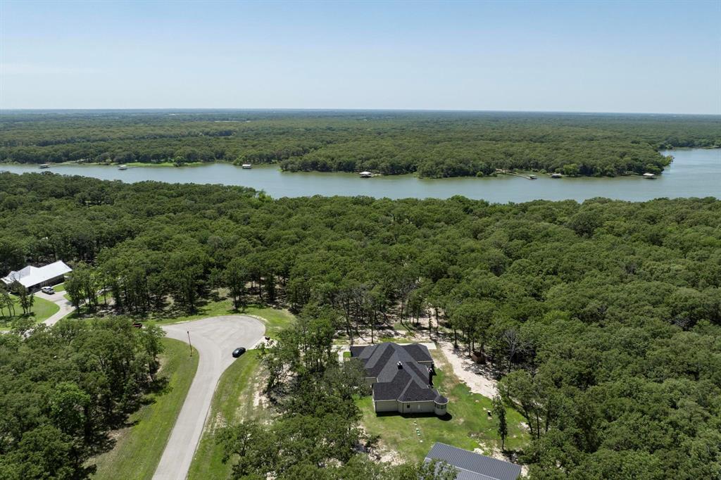 Lot 71 Anchor Quinlan, TX 75474 - Photo 15 of 18 a view of a lake with houses in the back