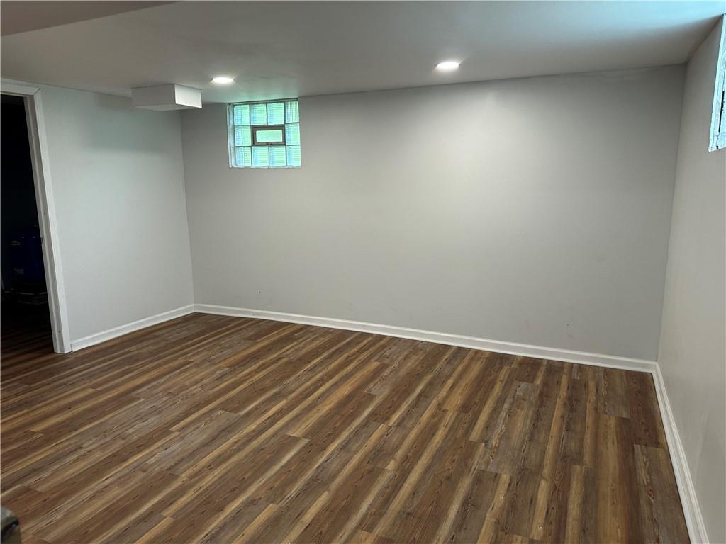 201 Clever Road McKees Rocks, PA 15136 - Photo 28 of 30 an empty room with wooden floor and windows