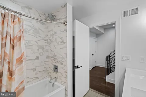 a view of a hallway to a bedroom