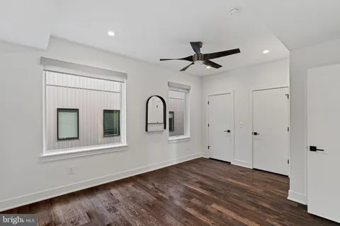 a view of entryway with wooden floor and stairs