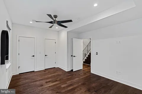 a view of hallway with wooden floor
