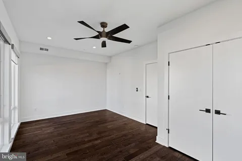 a bathroom with a shower and a glass door