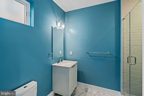 a bedroom with a large bed and a large window