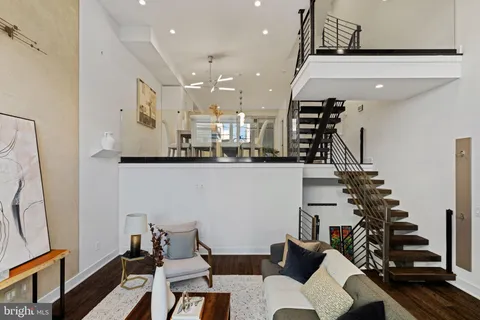 a kitchen with a sink appliances and cabinets