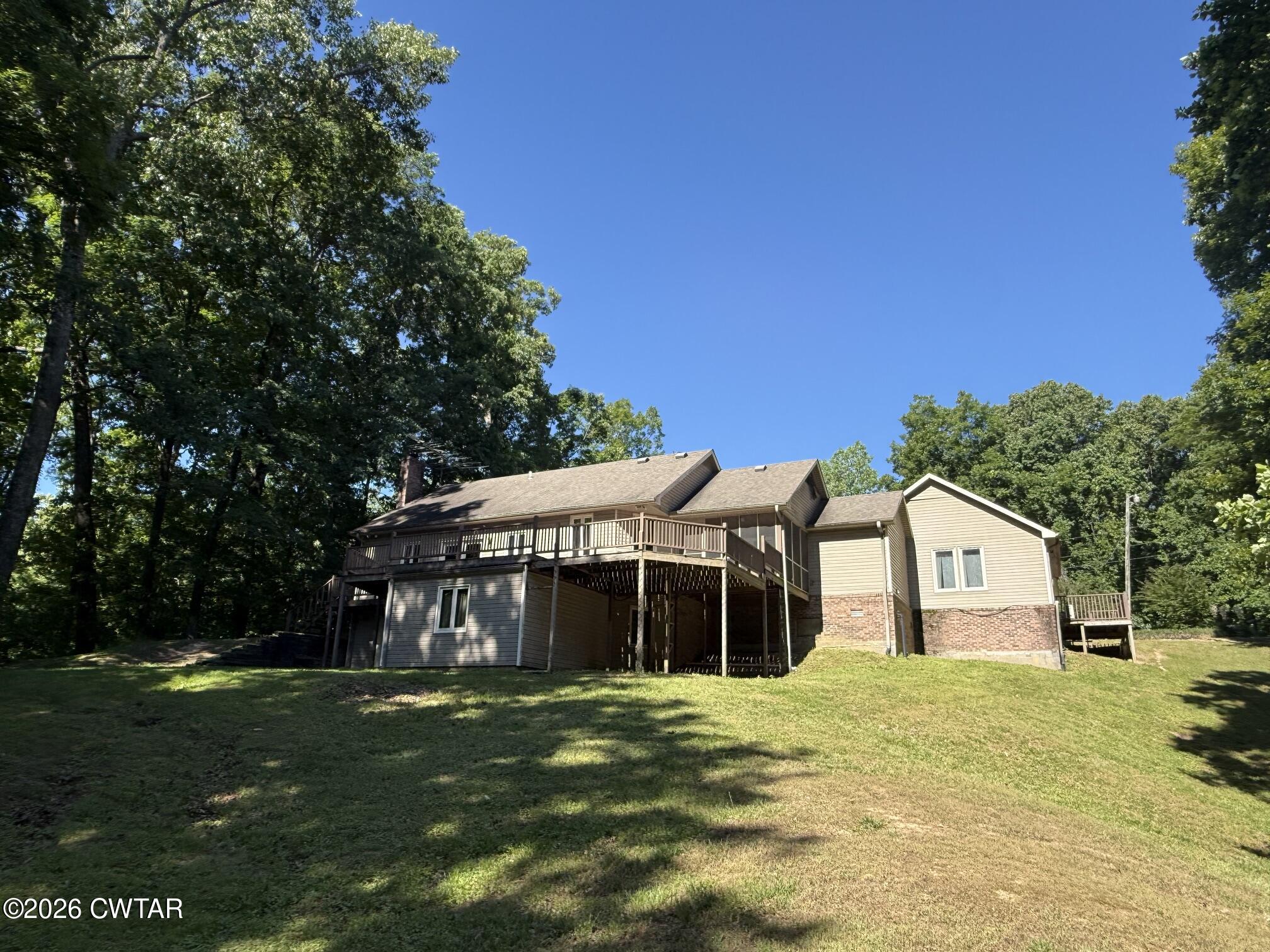 930 Oak Ridge Road Dyersburg, TN 38024 - Photo 1 of 59 a front view of a house with a garden