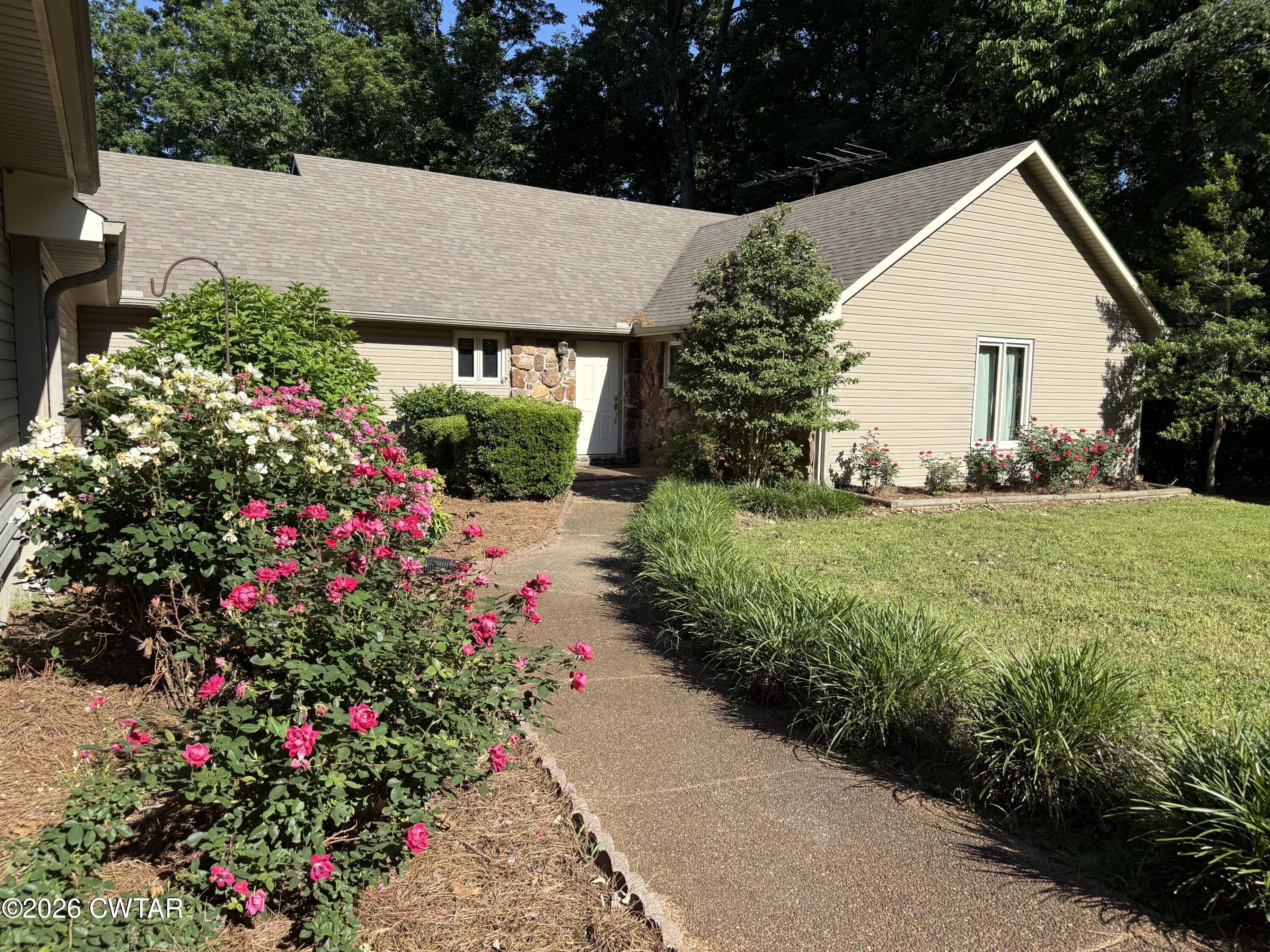 930 Oak Ridge Road Dyersburg, TN 38024 - Photo 12 of 59 a view of a house with a yard and garden