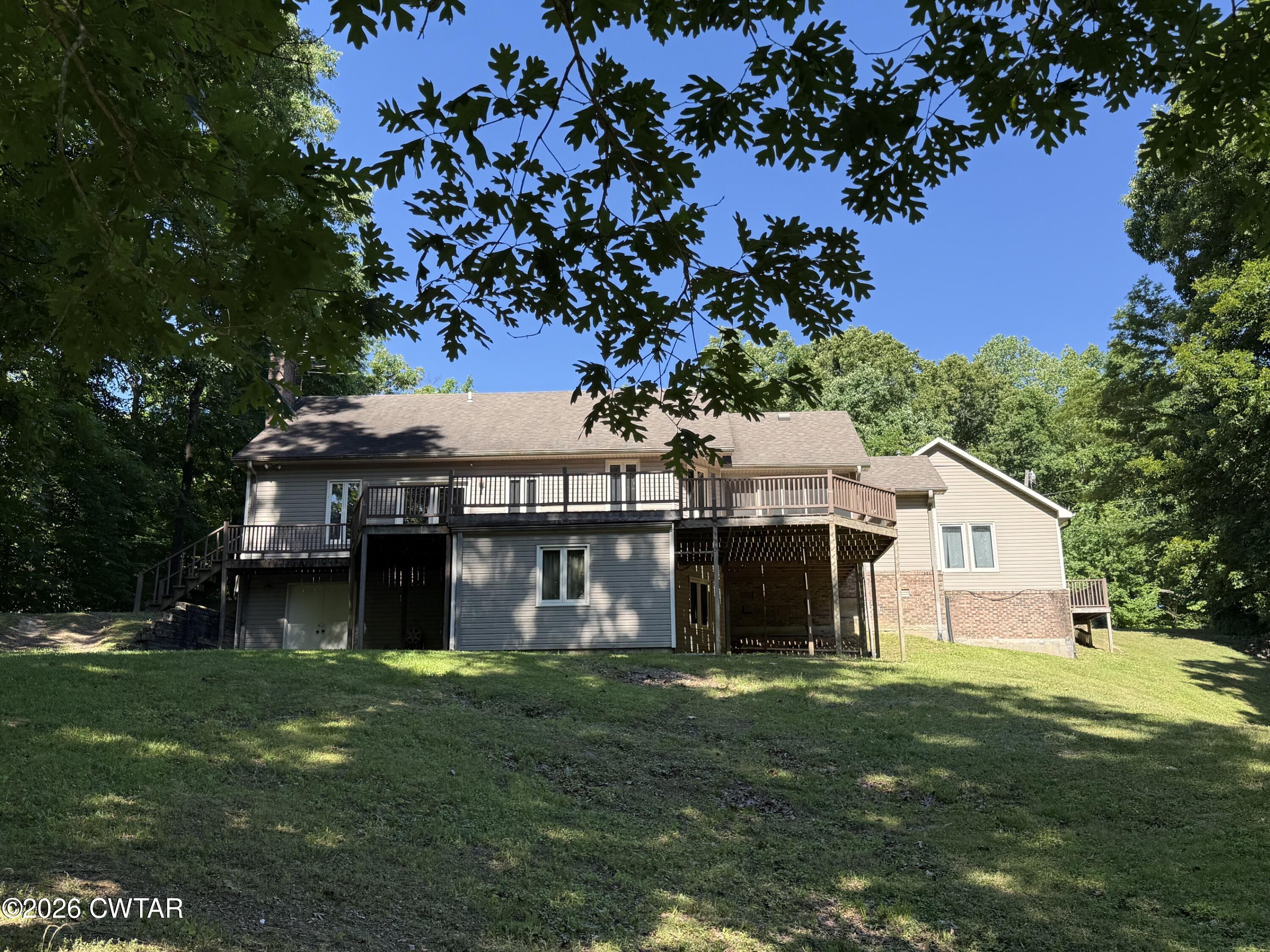 930 Oak Ridge Road Dyersburg, TN 38024 - Photo 2 of 59 a front view of a house with a garden
