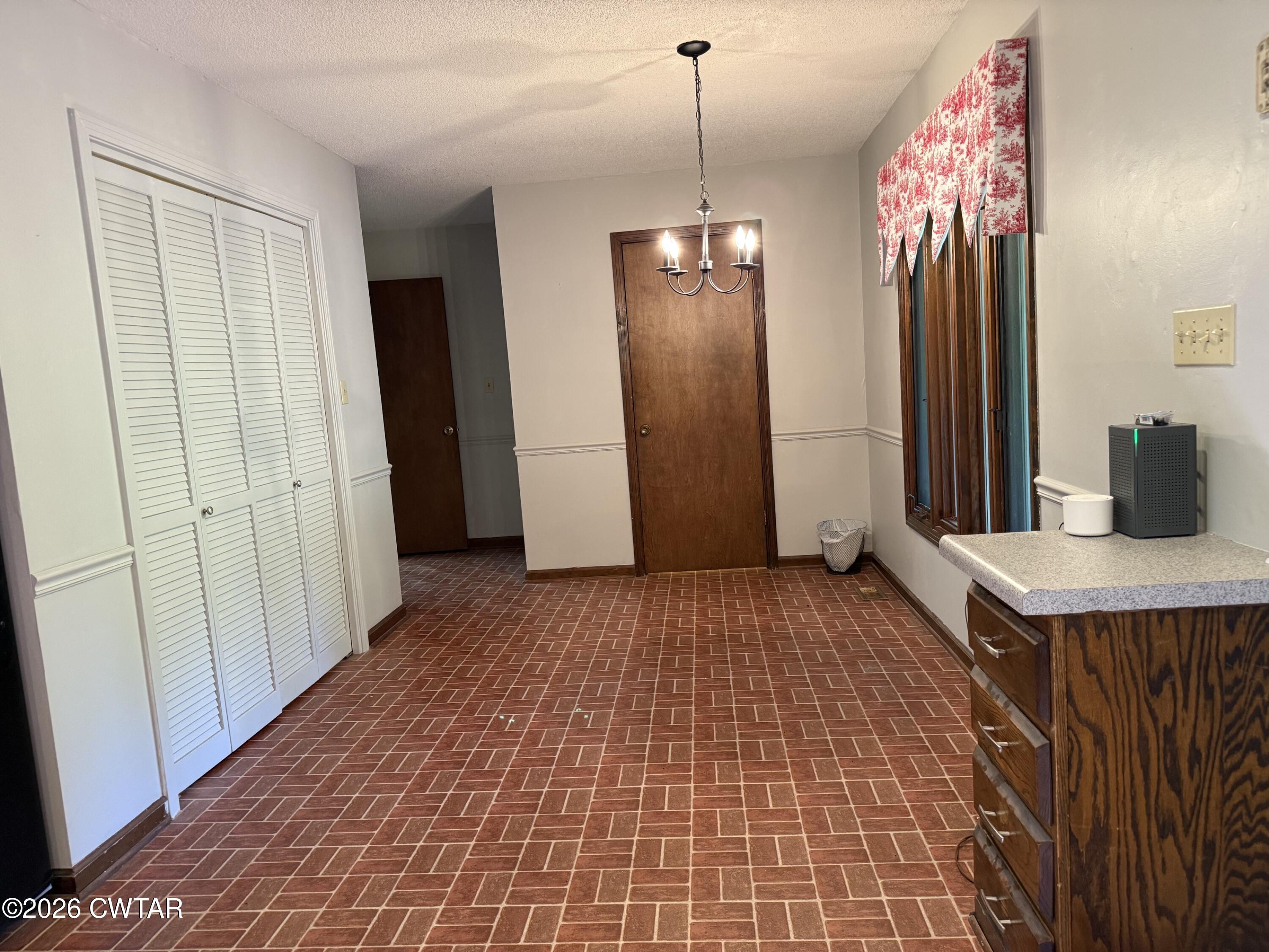 930 Oak Ridge Road Dyersburg, TN 38024 - Photo 28 of 59 a room with a table and chairs
