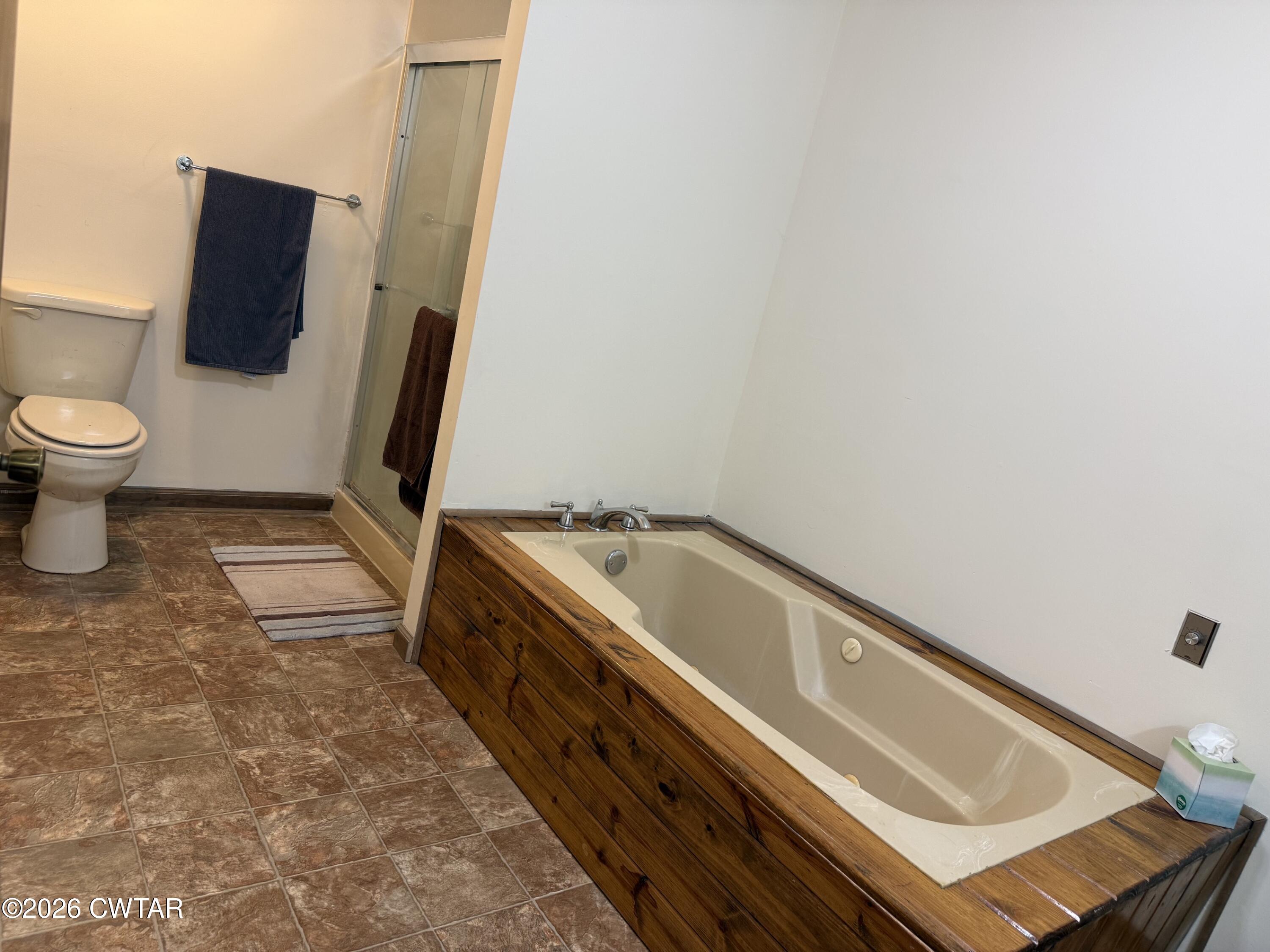930 Oak Ridge Road Dyersburg, TN 38024 - Photo 34 of 59 a spacious bathroom with a sink and a toilet