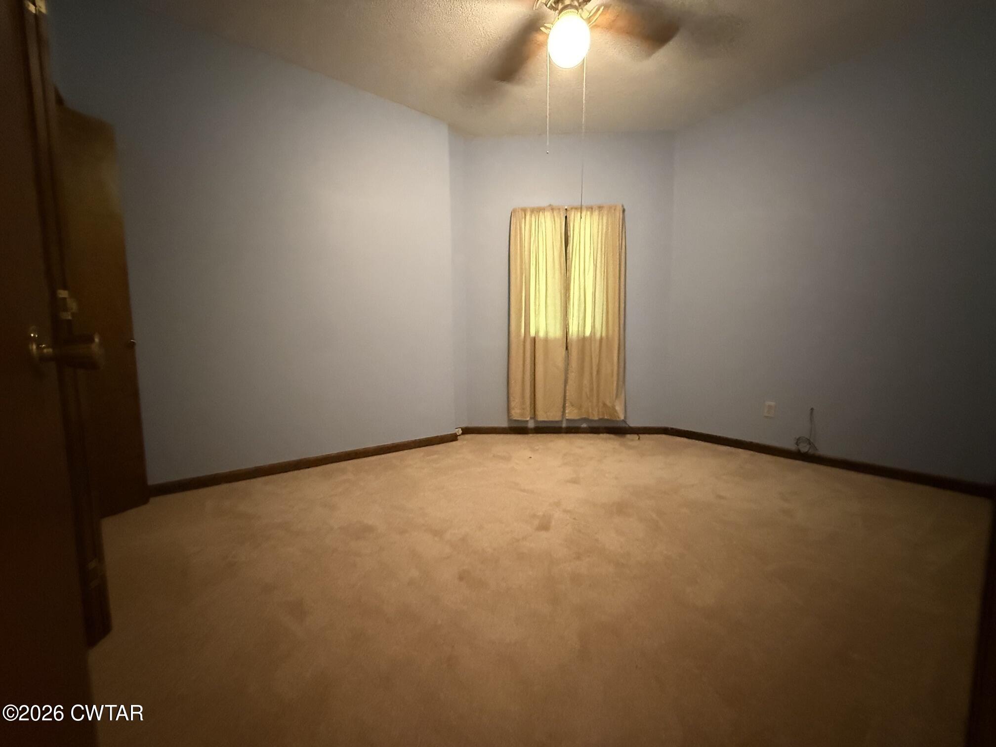 930 Oak Ridge Road Dyersburg, TN 38024 - Photo 38 of 59 a view of an empty room with a window