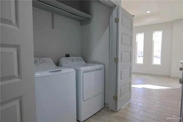 a view of storage and utility room with washer and dryer