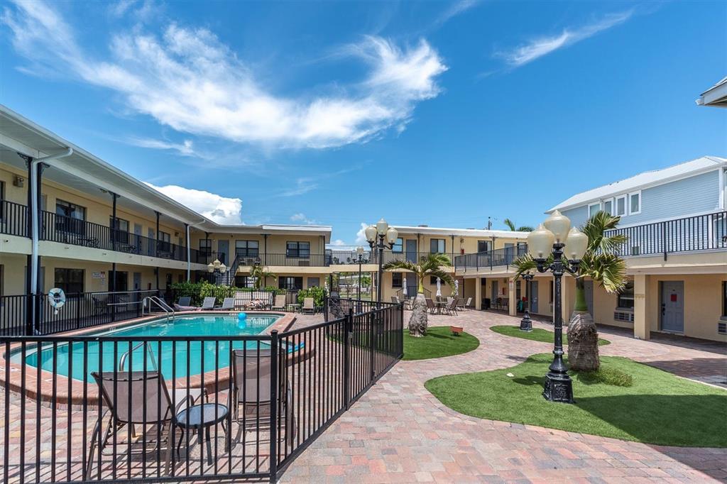 16333 Gulf Boulevard, Unit 217 St. Petersburg, FL 33708 - Photo 18 of 30 a view of building with yard