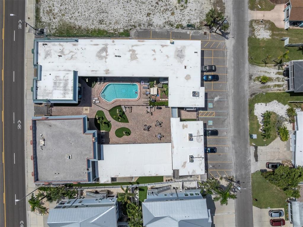 16333 Gulf Boulevard, Unit 217 St. Petersburg, FL 33708 - Photo 22 of 30 an aerial view of multiple houses with outdoor space