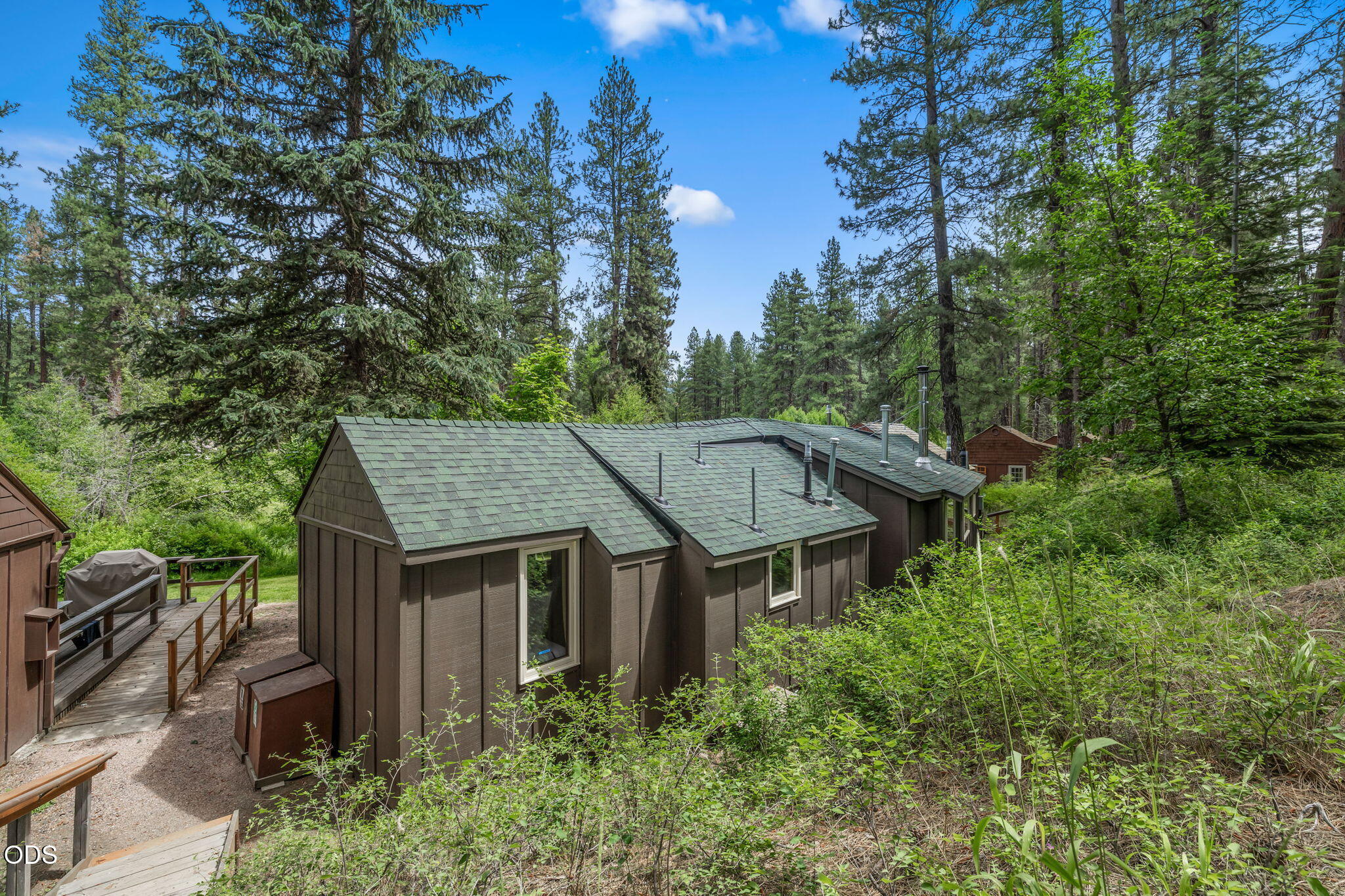 13375 Southwest Forest Service Road, Unit 3 U1 Camp Sherman, OR 97730 - Photo 29 of 29 an aerial view of a house with yard outdoor seating and green space