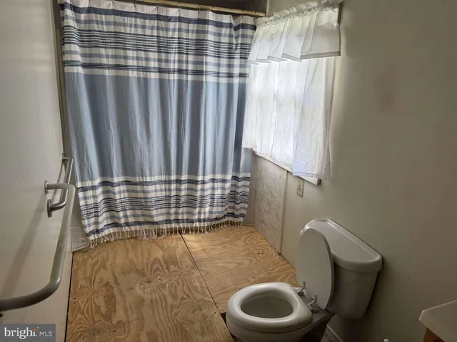 a bathroom with a toilet and sink