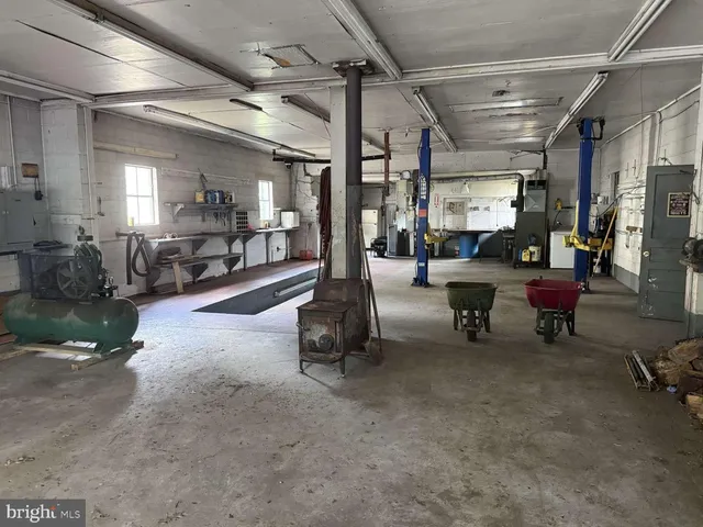 a living room with lots of furniture and gym equipment