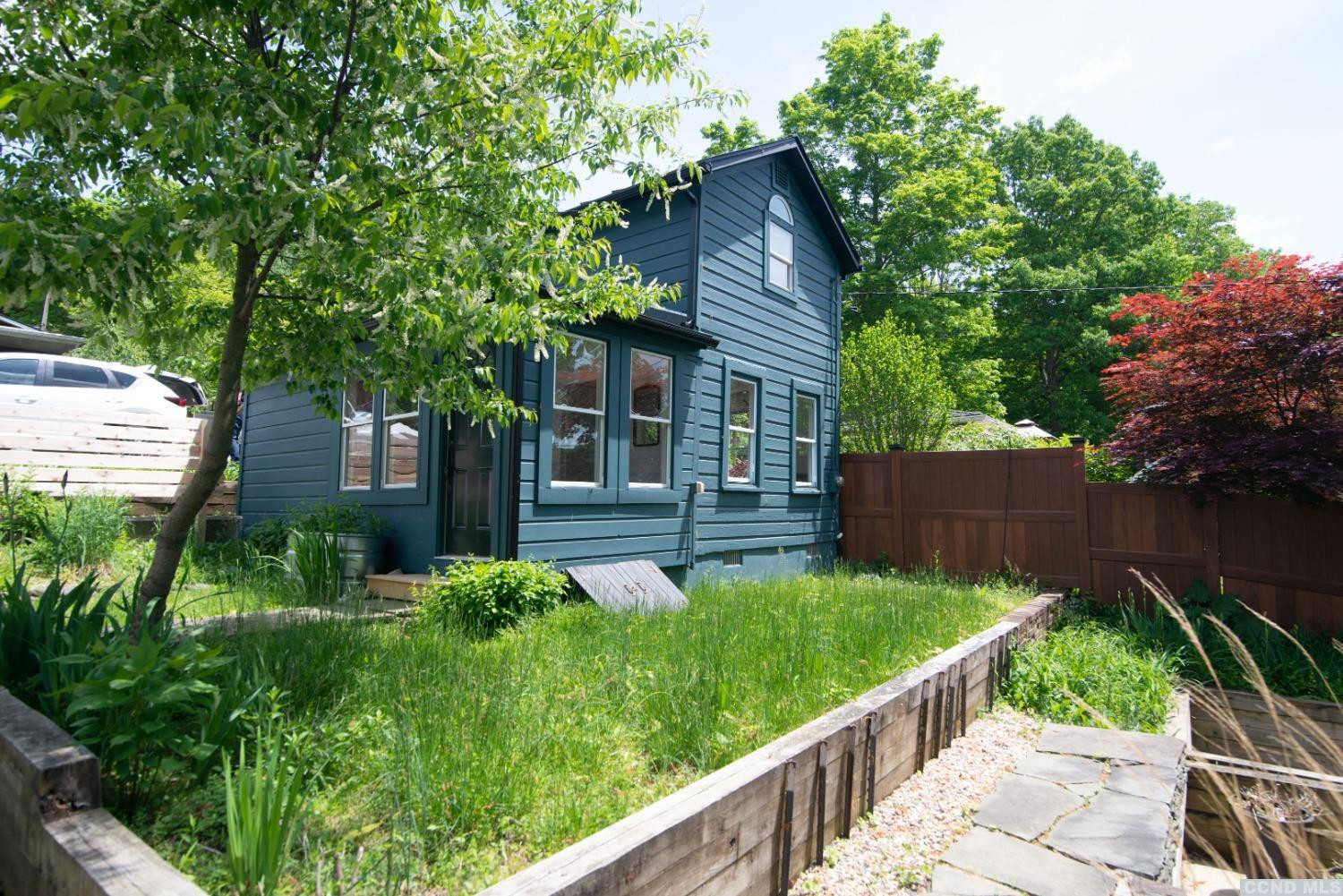 445 Lakeview Road Craryville, NY 12521 - Photo 23 of 45 a view of a garden with wooden fence