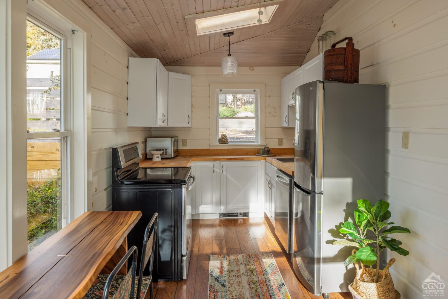445 Lakeview Road Craryville, NY 12521 - Photo 25 of 45 a kitchen with stainless steel appliances a refrigerator and a stove