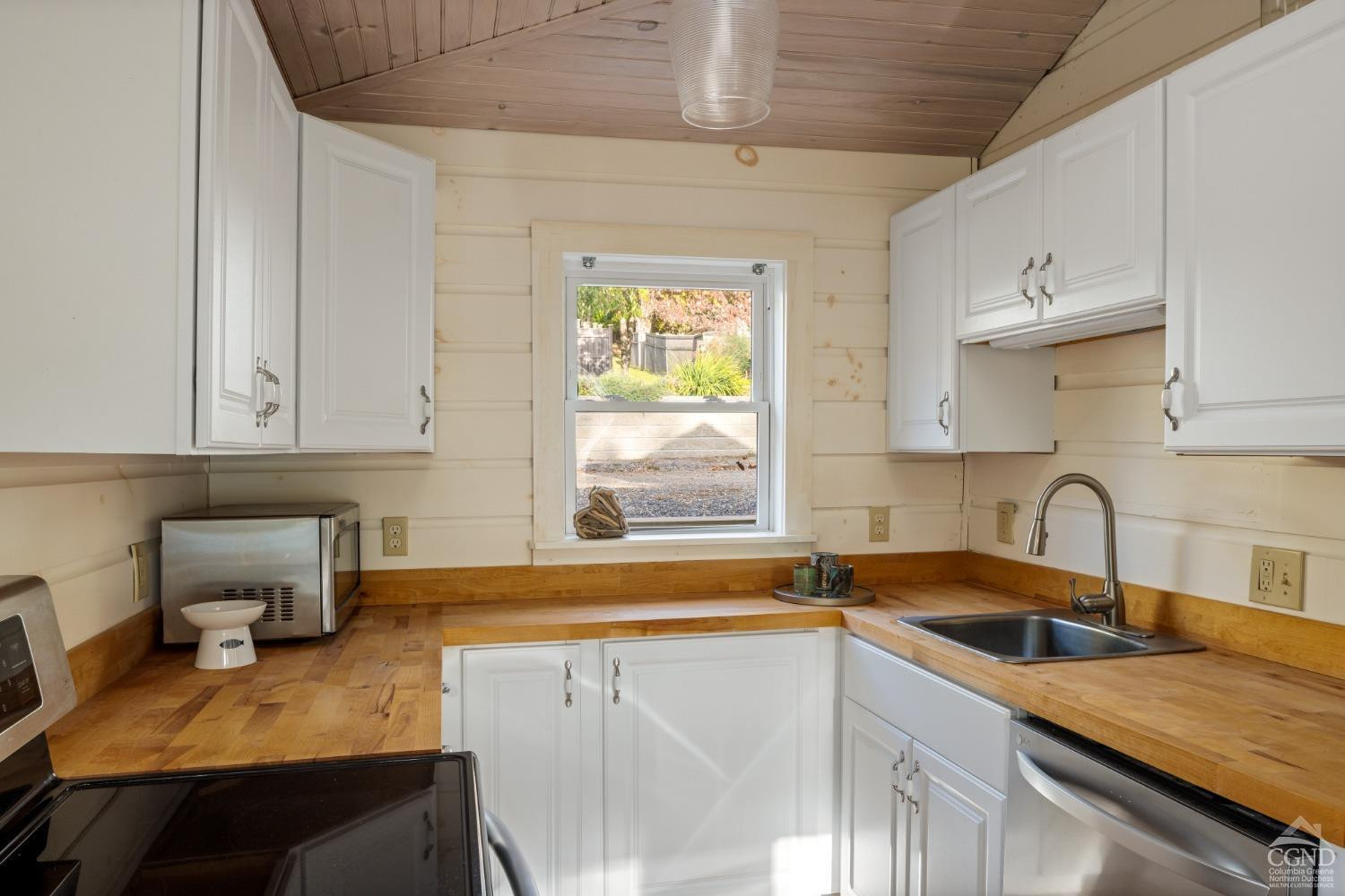 445 Lakeview Road Craryville, NY 12521 - Photo 26 of 45 a kitchen with a sink cabinets and window