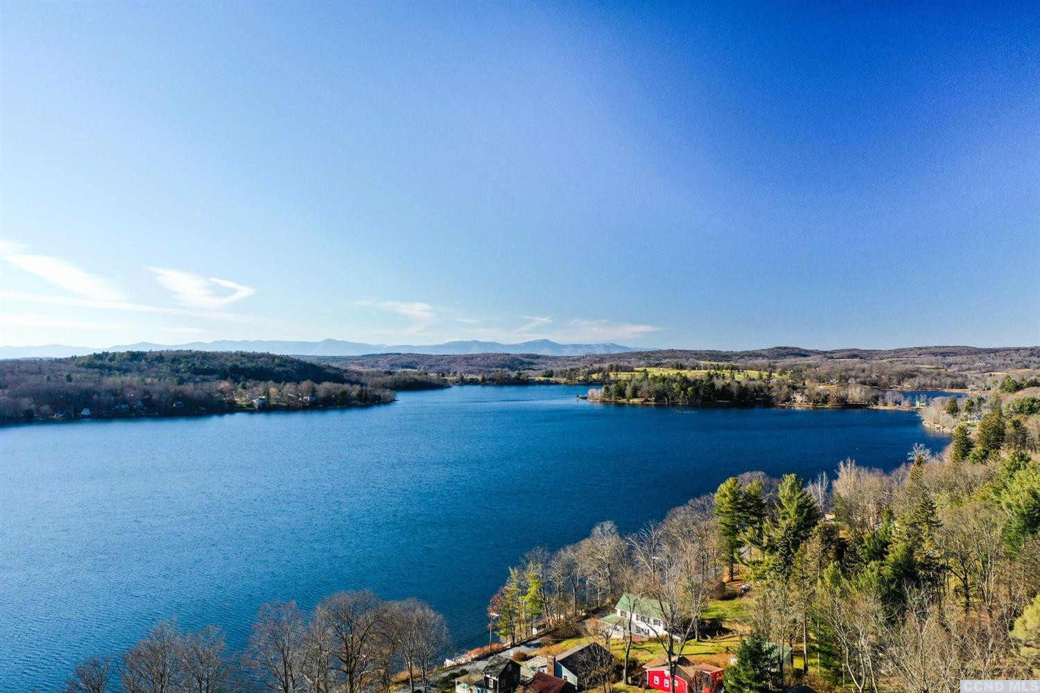 445 Lakeview Road Craryville, NY 12521 - Photo 3 of 45 a view of a lake with houses in the back