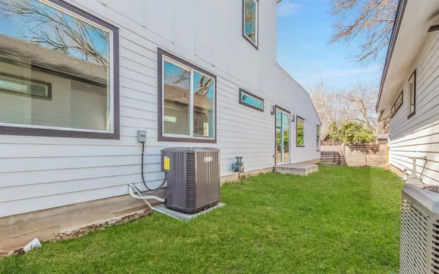a view of backyard with a garden and plants