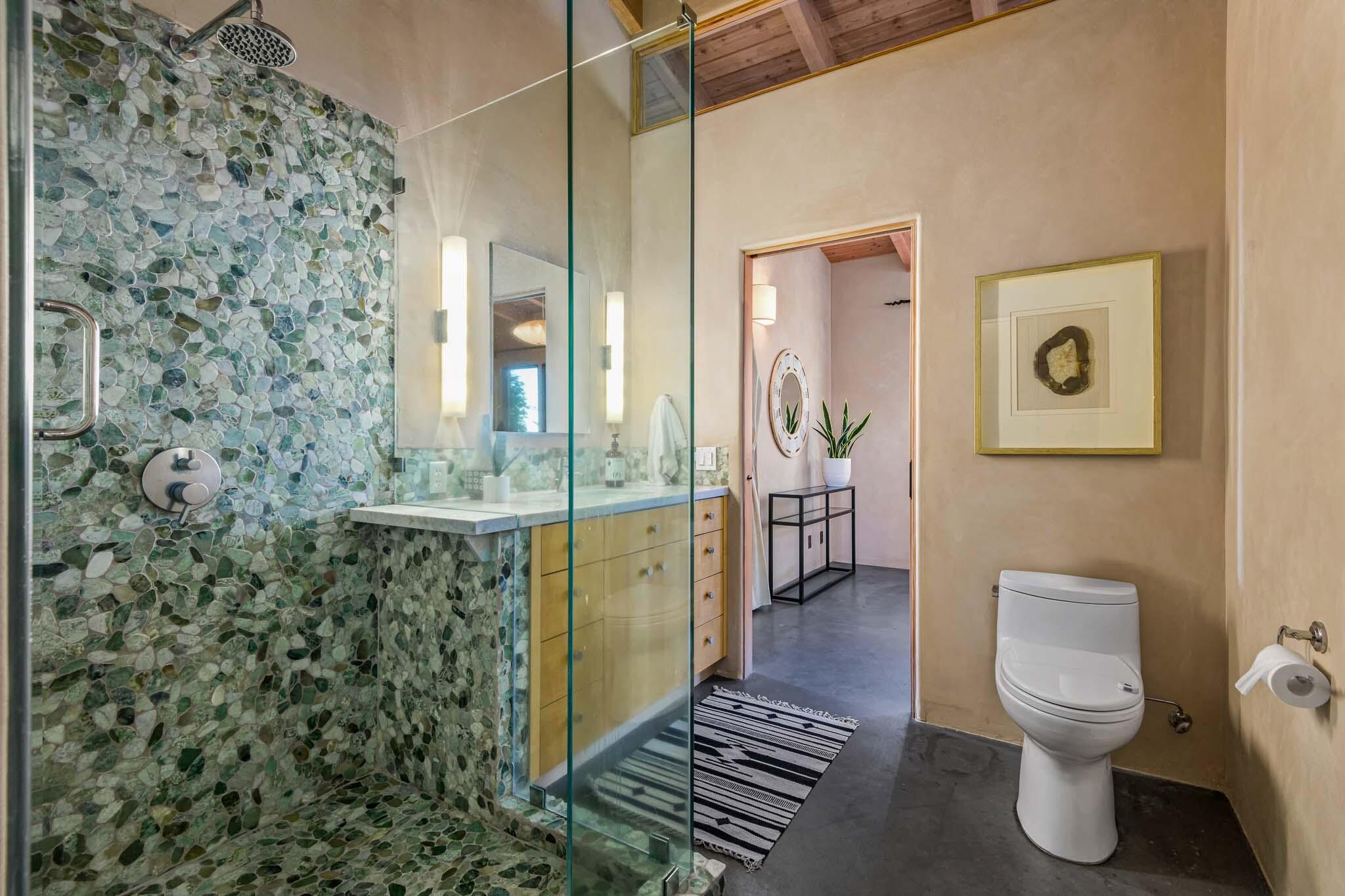 356 East Mountain Drive Montecito, CA 93108 - Photo 13 of 36 a bathroom with a granite countertop sink a toilet and shower